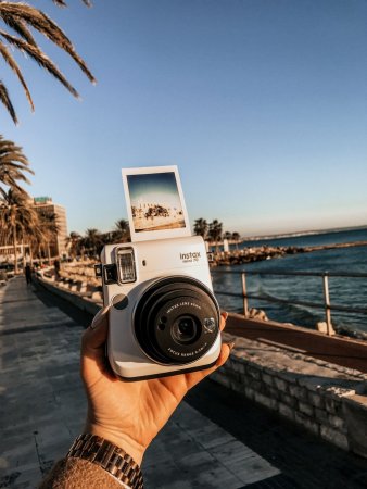 Фотоаппарат фотографирует