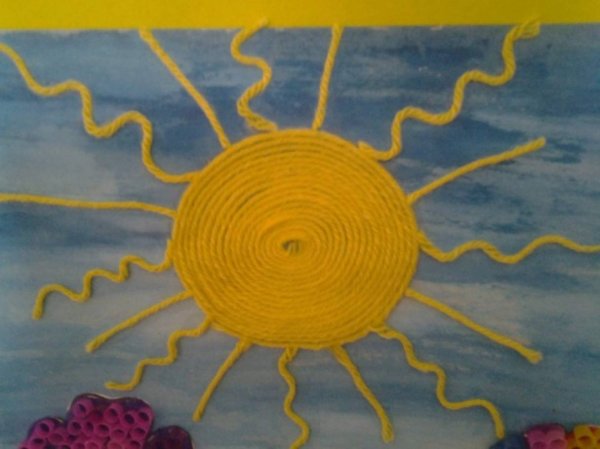 Солнышко из ниток