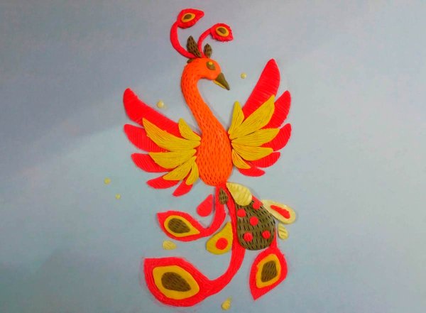 Жар птица из пластилина на картоне