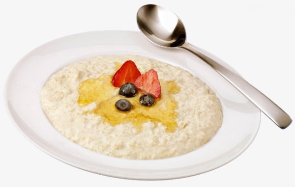 Каша в тарелке на белом фоне