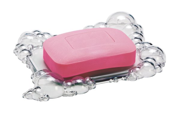 Мыло в мыльнице на белом фоне