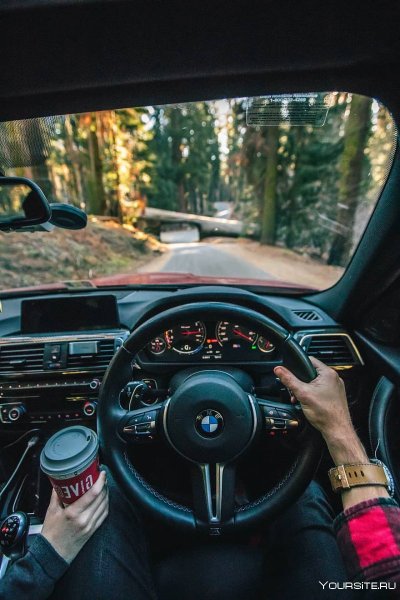 За рулём BMW 740