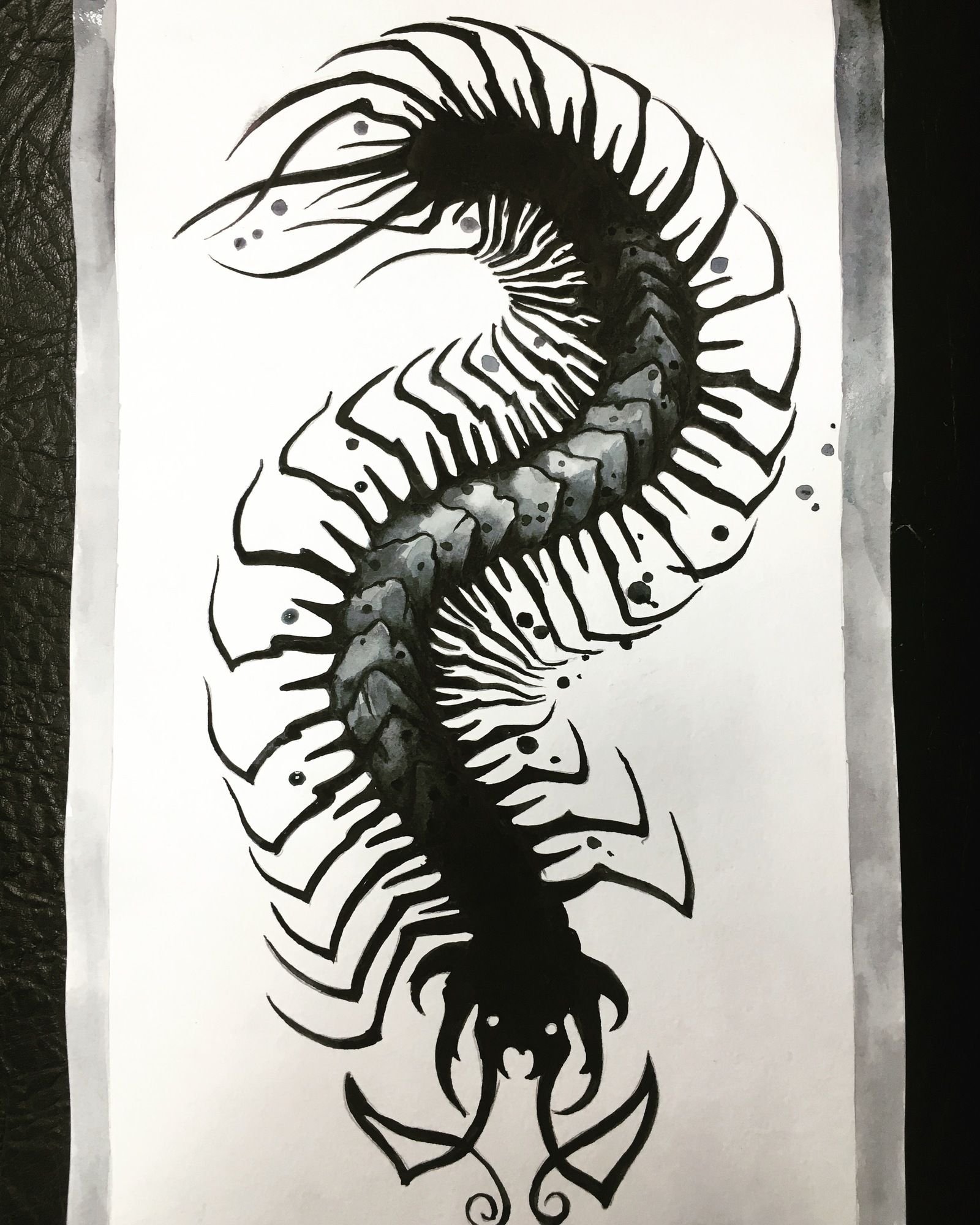 Black tribal centipede tattoos