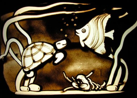 Рисование песком картины