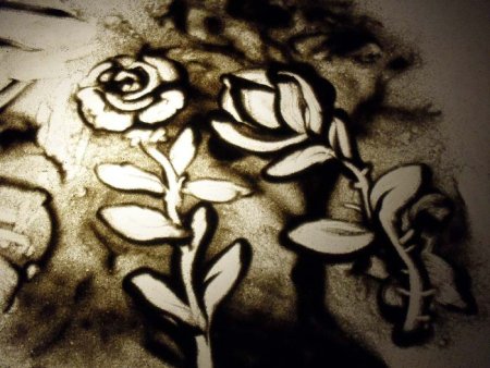 Рисование песком птицы