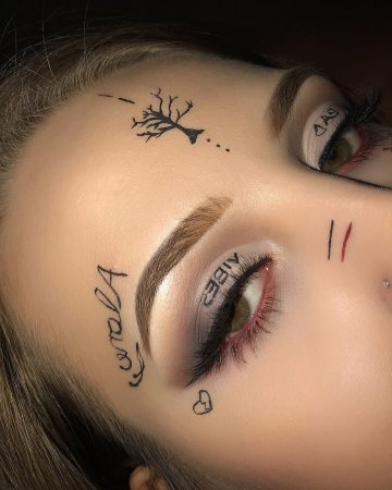 Тату на лице женские