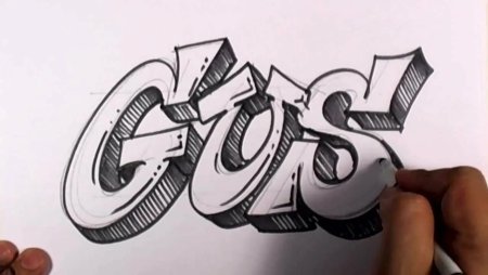 Школьник рисует граффити