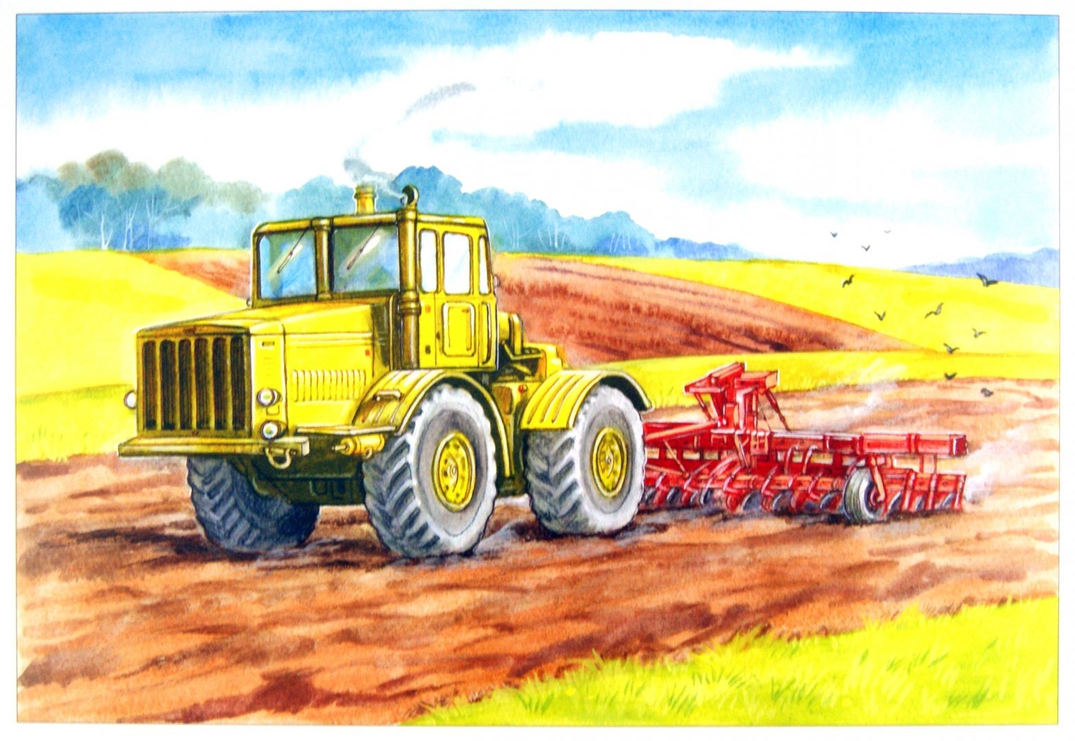 Трактор пашет землю