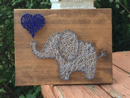 Поделка на доске с гвоздями и нитками