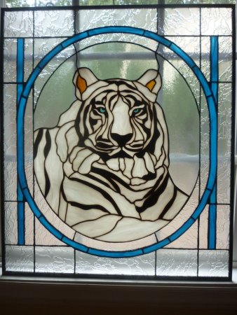 Витражи на стекле животные