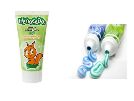 Зубная паста и щетка на белом фоне