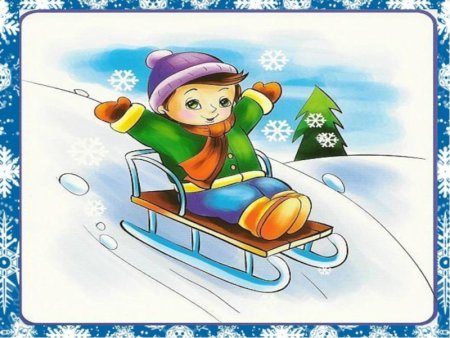 Мальчик катается с горки